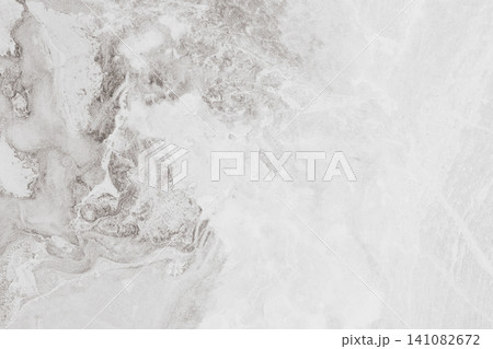 Horizontal top down flat lay shot of a light grey marble stone texture surface with natural abstract organic swirls and cracks for website backdrop or banner Horizontal top down flat lay shot of a light grey marble stone texture surface with natural abstract organic swirls and cracks for website backdrop or banner 141082672