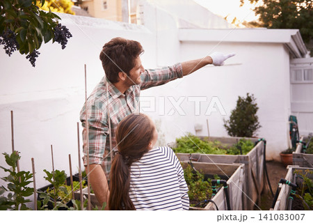 Father, daughter and gardening with pointing in home for bonding, happy family and curious child. Man, girl kid and learning with sustainability, agriculture and plant growth in backyard of house Father, daughter and gardening with pointing in home for bonding, happy family and curious child. Man, girl kid and learning with sustainability, agriculture and plant growth in backyard of house 141083007