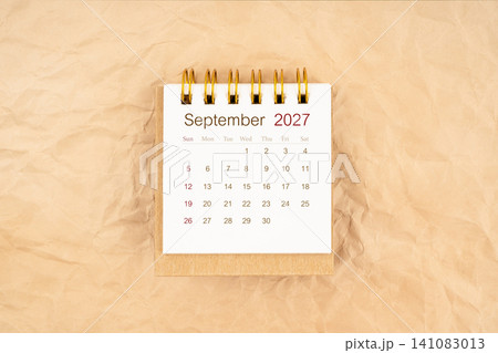 September 2027 mini desk calendar on old paper. September 2027 mini desk calendar on old paper. 141083013