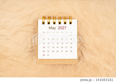 May 2027 mini desk calendar on old paper. May 2027 mini desk calendar on old paper. 141083181