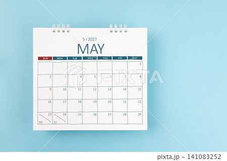 May 2027 Monthly desk calendar for 2026 year on blue color background. Flat lay. May 2027 Monthly desk calendar for 2026 year on blue color background. Flat lay. 141083252