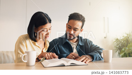 Couple, reading or Bible study for religion in house, coffee and listen to scripture with faith in God. People, book or learning Christianity for worship, bonding and spiritual growth with gospel Couple, reading or Bible study for religion in house, coffee and listen to scripture with faith in God. People, book or learning Christianity for worship, bonding and spiritual growth with gospel 141083773