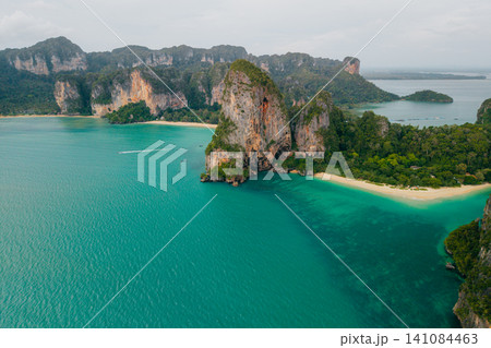 Beautiful aerial view of tropical limestone islands and turquoise bay in Krabi, Thailand. Beautiful aerial view of tropical limestone islands and turquoise bay in Krabi, Thailand. 141084463