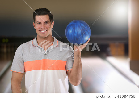 Man with ball in modern bowling club Man with ball in modern bowling club 141084759