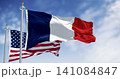 National flags of France and USA waving in the wind on a clear day 141084847