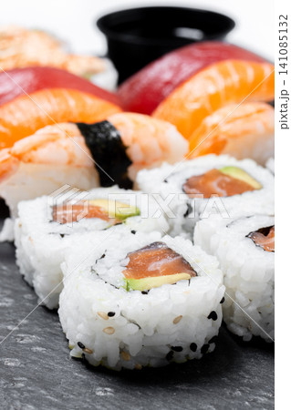 Assorted sushi platter with nigiri and maki rolls Assorted sushi platter with nigiri and maki rolls 141085132