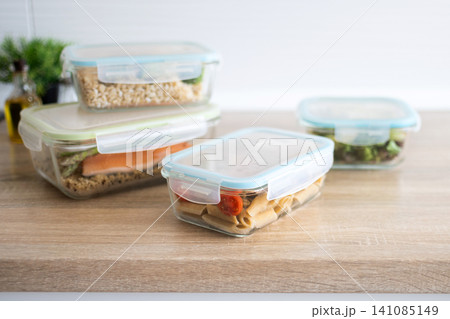 Stack of healthy meal prep containers with fresh homemade lunches 141085149