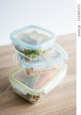 Stack of healthy meal prep containers with fresh homemade lunches 141085151