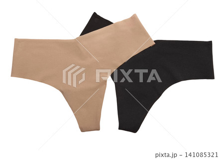 pair of black and beige women's panties on a white background. Elegant lace lingerie with a floral pattern and romantic design, perfect for fashion, beauty, and intimate settings 141085321