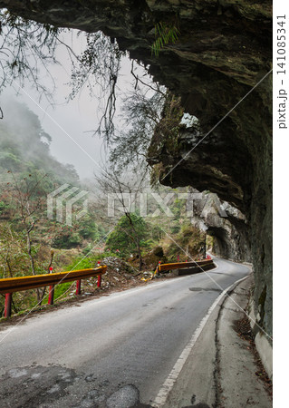 Mountain road under rock tunnel in Taiwan Mountain road under rock tunnel in Taiwan 141085341