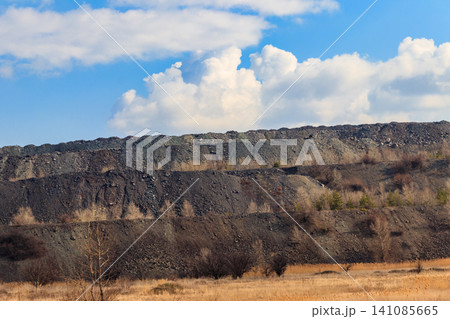View of slag heaps of iron ore quarry. Mining industry View of slag heaps of iron ore quarry. Mining industry 141085665