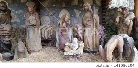 Rustic hand carved wooden nativity scene with holy family and magi Rustic hand carved wooden nativity scene with holy family and magi 141086104