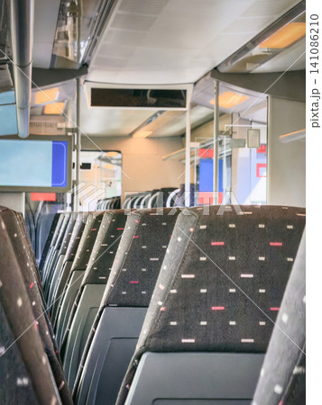 Modern Train Interior with Empty Passenger Seats Modern Train Interior with Empty Passenger Seats 141086210