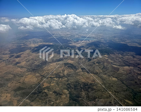 Etna volcano erupting aerial view from airplane Etna volcano erupting aerial view from airplane 141086584