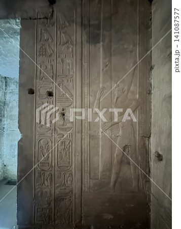 Beautiful bas-reliefs and ancient hieroglyphs in the Temple of Seti I in Abydos, Egypt. 141087577