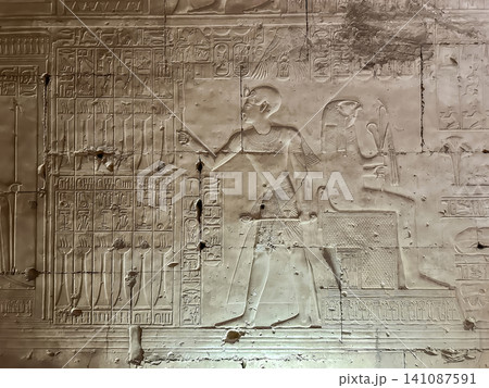 Beautiful bas-reliefs and ancient hieroglyphs in the Temple of Seti I in Abydos, Egypt. Beautiful bas-reliefs and ancient hieroglyphs in the Temple of Seti I in Abydos, Egypt. 141087591