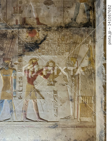 Beautiful bas-reliefs and ancient hieroglyphs in the Temple of Seti I in Abydos, Egypt. Beautiful bas-reliefs and ancient hieroglyphs in the Temple of Seti I in Abydos, Egypt. 141087682