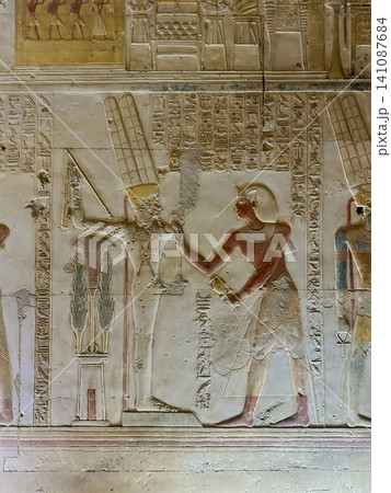 Beautiful bas-reliefs and ancient hieroglyphs in the Temple of Seti I in Abydos, Egypt. Beautiful bas-reliefs and ancient hieroglyphs in the Temple of Seti I in Abydos, Egypt. 141087684