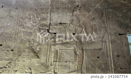 Beautiful bas-reliefs and ancient hieroglyphs in the Temple of Seti I in Abydos, Egypt. Beautiful bas-reliefs and ancient hieroglyphs in the Temple of Seti I in Abydos, Egypt. 141087754