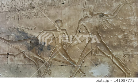 Beautiful bas-reliefs and ancient hieroglyphs in the Temple of Seti I in Abydos, Egypt. Beautiful bas-reliefs and ancient hieroglyphs in the Temple of Seti I in Abydos, Egypt. 141087775