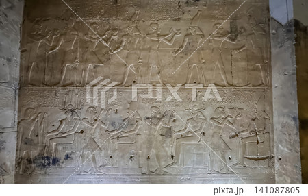 Beautiful bas-reliefs and ancient hieroglyphs in the Temple of Seti I in Abydos, Egypt. Beautiful bas-reliefs and ancient hieroglyphs in the Temple of Seti I in Abydos, Egypt. 141087805