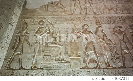 Beautiful bas-reliefs and ancient hieroglyphs in the Temple of Seti I in Abydos, Egypt. Beautiful bas-reliefs and ancient hieroglyphs in the Temple of Seti I in Abydos, Egypt. 141087811