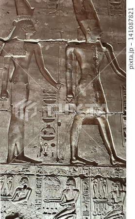 Beautiful bas-reliefs and ancient hieroglyphs in the Temple of Seti I in Abydos, Egypt. Beautiful bas-reliefs and ancient hieroglyphs in the Temple of Seti I in Abydos, Egypt. 141087821