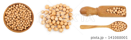 Dry raw organic chickpeas in wooden bowl isolated on white background. Top view Dry raw organic chickpeas in wooden bowl isolated on white background. Top view 141088001