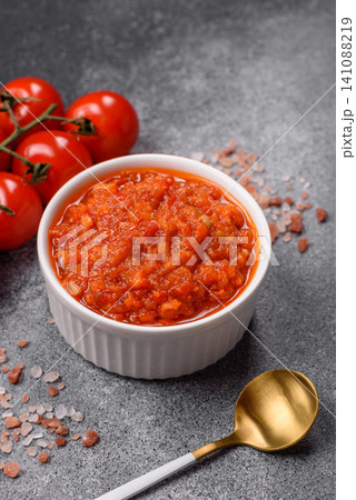 Red tomato Bolognese sauce with spices, salt, pepper, and herbs. A red sauce Red tomato Bolognese sauce with spices, salt, pepper, and herbs. A red sauce 141088219