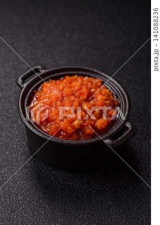 Red tomato Bolognese sauce with spices, salt, pepper, and herbs. A red sauce Red tomato Bolognese sauce with spices, salt, pepper, and herbs. A red sauce 141088236