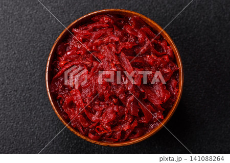 Grated beetroot with salt and spices as an ingredient for borscht or a vegan salad. Grated beetroot Grated beetroot with salt and spices as an ingredient for borscht or a vegan salad. Grated beetroot 141088264
