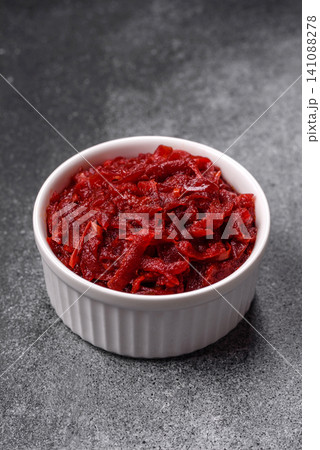 Grated beetroot with salt and spices as an ingredient for borscht or a vegan salad. Grated beetroot Grated beetroot with salt and spices as an ingredient for borscht or a vegan salad. Grated beetroot 141088278