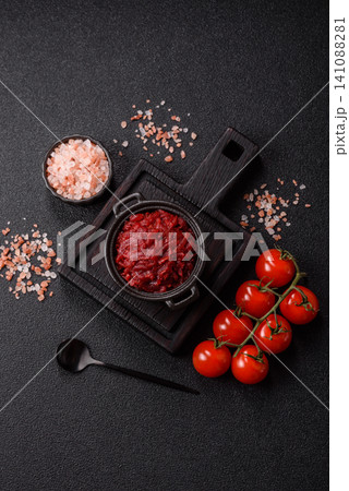 Grated beetroot with salt and spices as an ingredient for borscht or a vegan salad. Grated beetroot 141088281