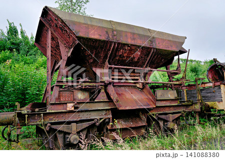 Close up of a heavily rusted brown old train cargo wagon side Close up of a heavily rusted brown old train cargo wagon side 141088380