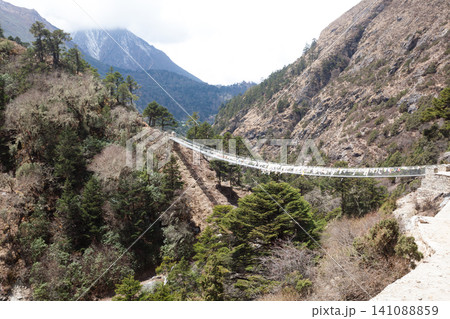 Imja river suspension bridge view along EBC trek, Nepal Imja river suspension bridge view along EBC trek, Nepal 141088859