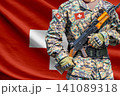 Switzerland flag with soldier holding assault rifle 141089318