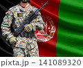 Afghanistan flag with soldier holding assault rifle 141089320