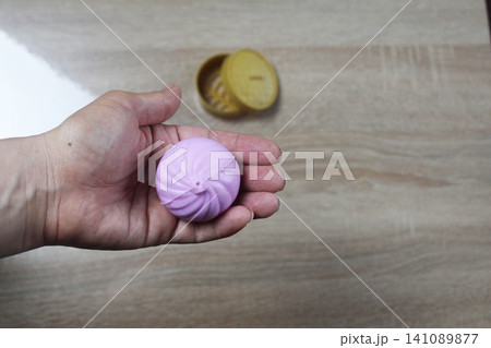 Holding Anti-Stress Toy in the Palm of Your Hand Horizontal Photo Holding Anti-Stress Toy in the Palm of Your Hand Horizontal Photo 141089877