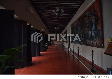 Long museum corridor with paintings and wooden ceiling Long museum corridor with paintings and wooden ceiling 141090335