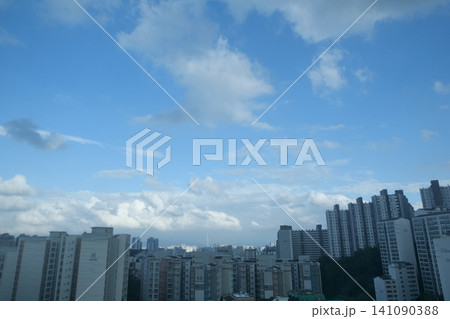 Urban cityscape and residential area view on a bright day Urban cityscape and residential area view on a bright day 141090388