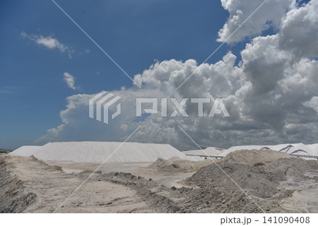 Expansive salt flat landscape under stormy clouds Expansive salt flat landscape under stormy clouds 141090408