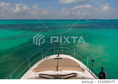 Yacht bow cruising over crystal clear turquoise water Yacht bow cruising over crystal clear turquoise water 141090475