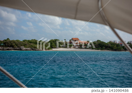 Luxury beach house viewed from boat offshore Luxury beach house viewed from boat offshore 141090486