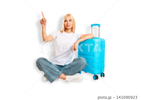 Woman sits beside turquoise suitcase and points up, PNG Woman sits beside turquoise suitcase and points up, PNG 141090923