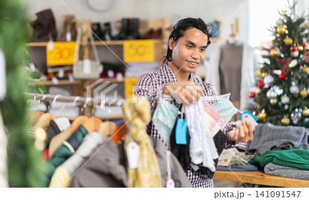 In chain shop, Indonesian man choose ladys lingerie panties, X mas shopping In chain shop, Indonesian man choose ladys lingerie panties, X mas shopping 141091547