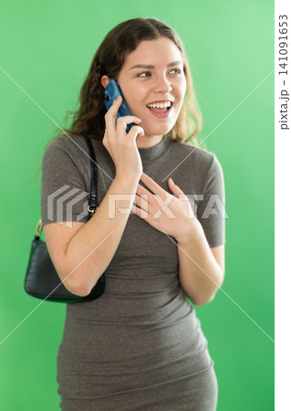 Female person is talking on phone Female person is talking on phone 141091653
