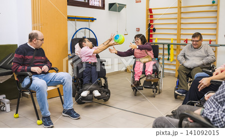 People with disability playing ball, physical therapy, rehabilitation People with disability playing ball, physical therapy, rehabilitation 141092015