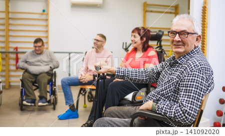 Group of people with disability participating in physical therapy Group of people with disability participating in physical therapy 141092020