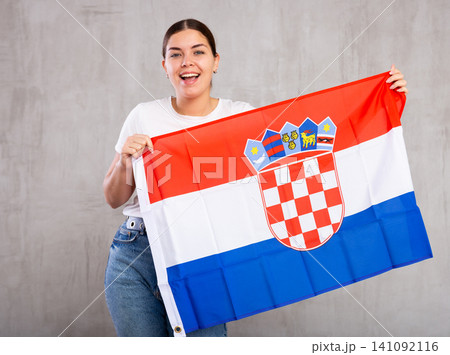 Positive woman supporting Croatia on world championship Positive woman supporting Croatia on world championship 141092116