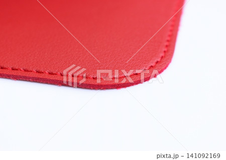 shiny red leather texture isolated on white background 141092169